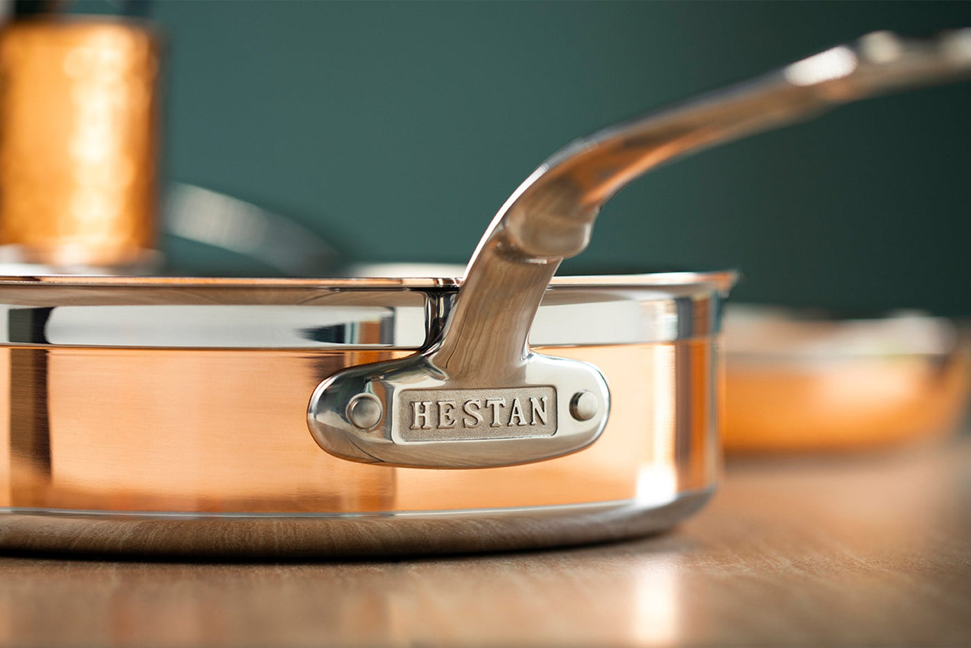 Lifestyle Photograph of Hestan UK Logo on Copper Induction Pan