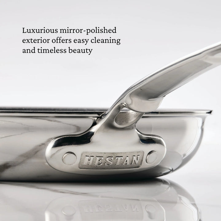 Close-up of a Hestan cookware handle with text about its polished exterior.