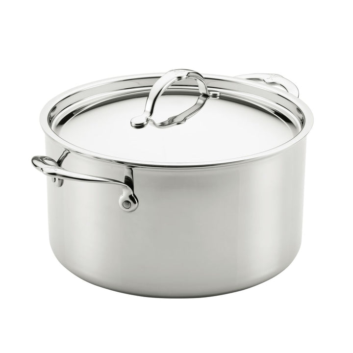 Stainless steel pot with lid on a white background