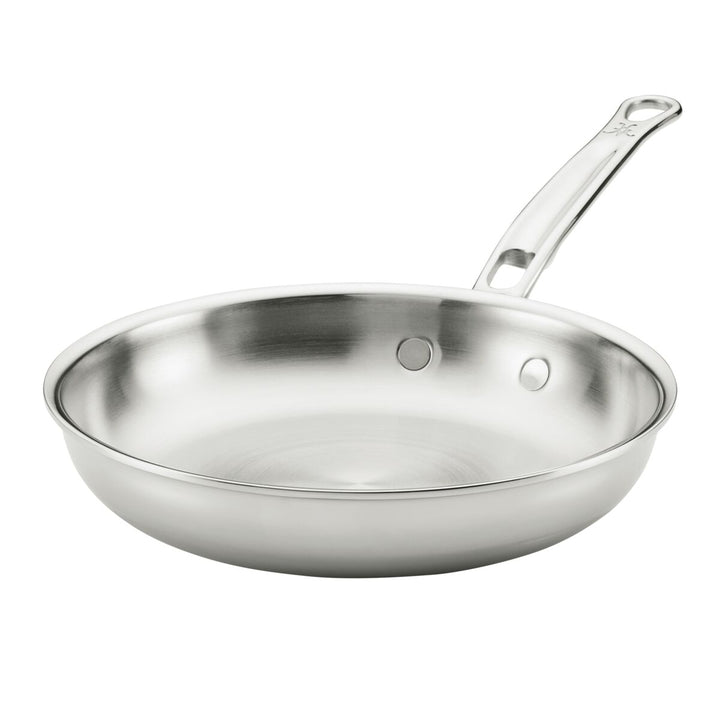 Stainless steel frying pan on a white background